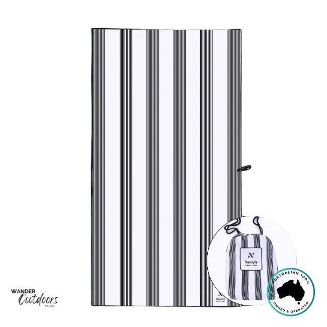 Flat-lay of Newlyfe Signature Santorini Black Towel showing crisp black and white stripe pattern and stitched branding.
