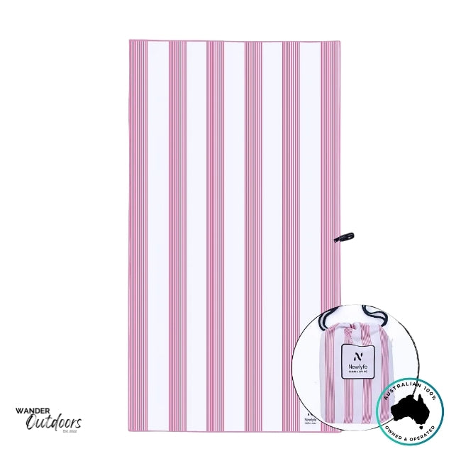 Flat-lay of Newlyfe Signature Sanur Pink Towel with crisp pink and white stripe design.