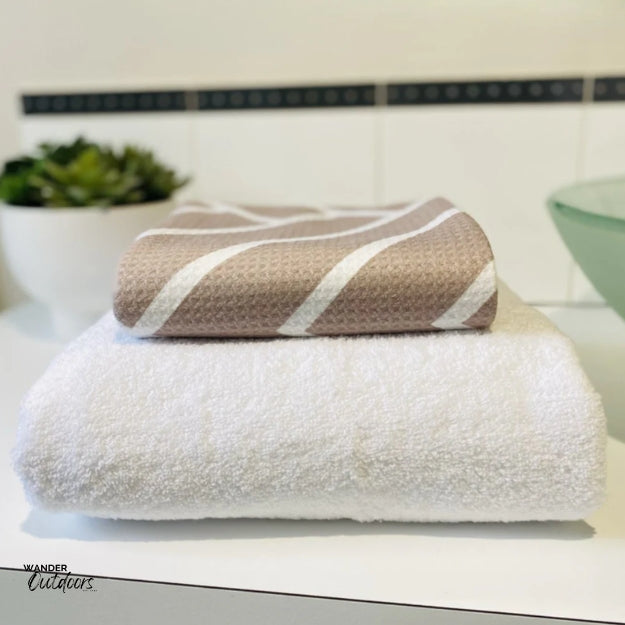 Newlyfe Waffle Weave Bath Towel Sandstone Compact folded on bulky cotton towel