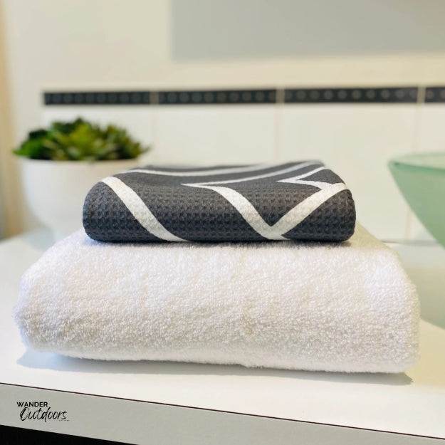 Newlyfe Waffle Weave Bath Towel Slate folded on bulky cotton towel