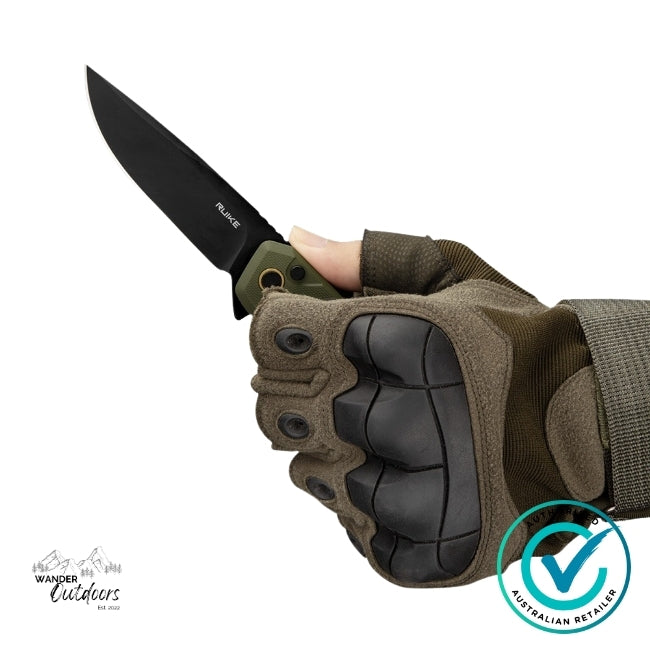 Close-up of the Ruike P873-G Folding Knife held in a gloved hand, showing the black stonewashed 14C28N blade and OD Green G10 handle — designed for secure one-handed control.