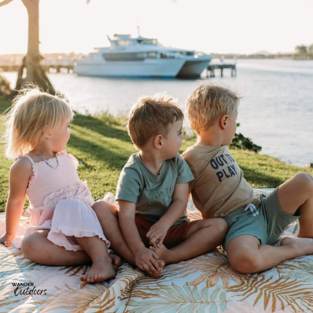 Saltwater Picnic Co Picnic Rug Golden Palm Kids on foreshore