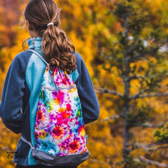 SkogAKust 2 in 1 dry bag in tie dye walking in outdoors