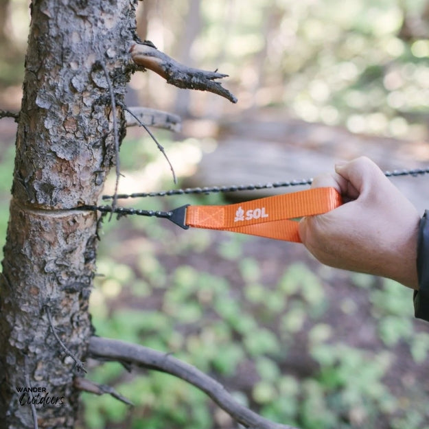 SOL Pocket Chain Saw Cutting Tree