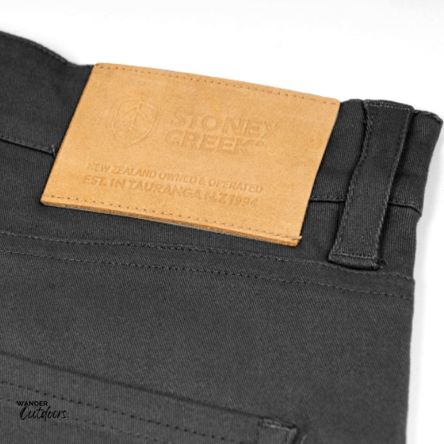 Stoney Creek Men's Urban Trousers in Black leather logo close up