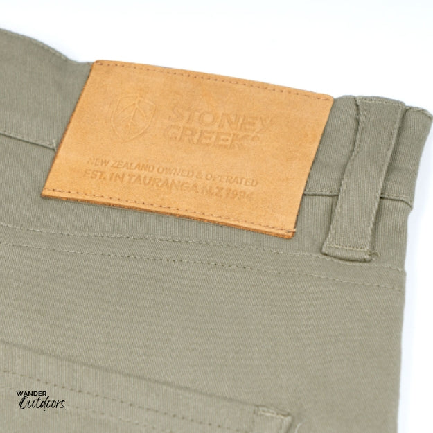 Stoney Creek Men's Urban Trousers in Dark Putty leather logo close up