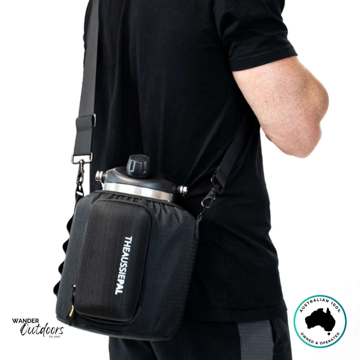 The Aussie Pal 4L Hydro Jug Sling in black displayed on shoulder with detachable strap and reinforced clips for secure carrying.