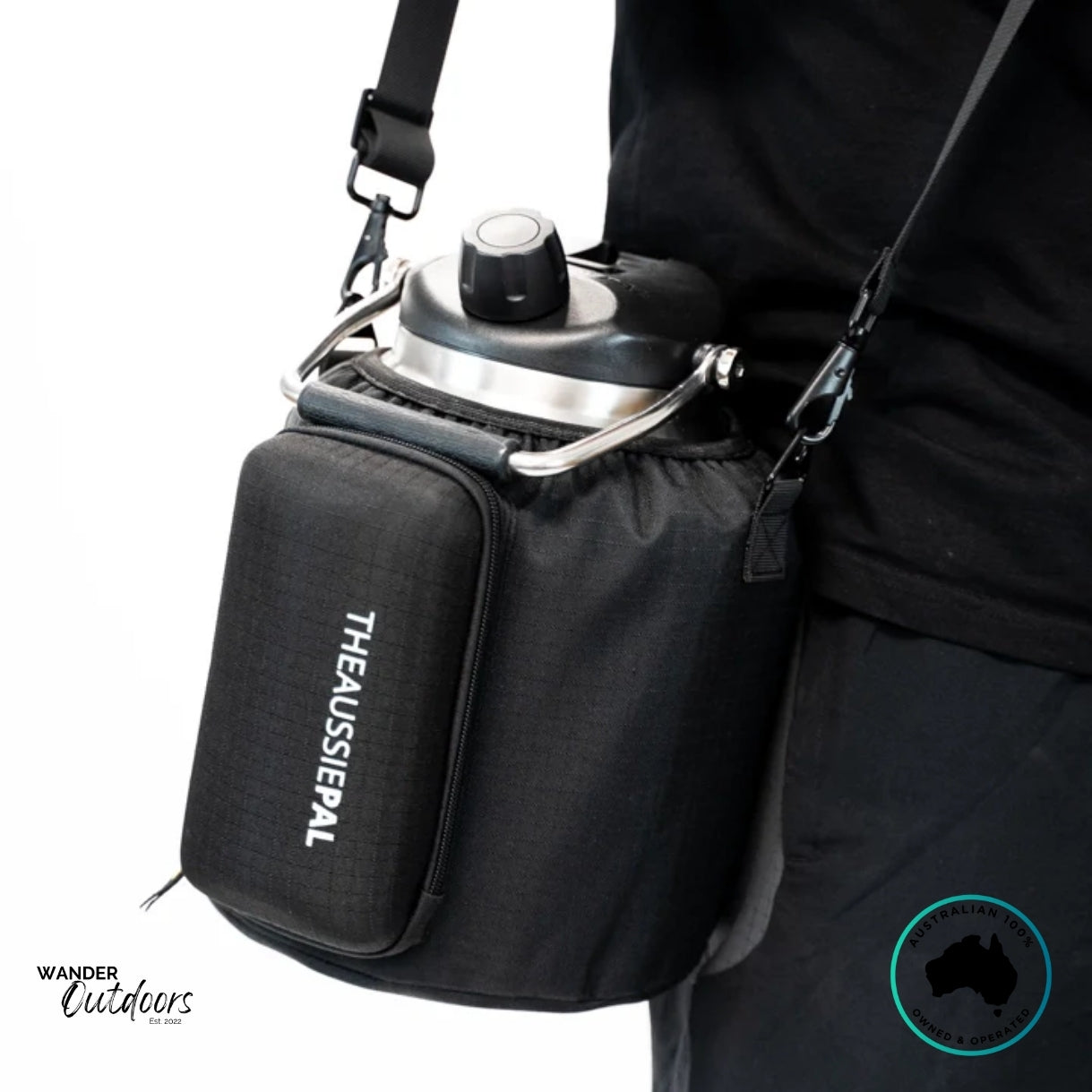 Side view of The Aussie Pal 4L Hydro Jug Bottle Sling in black worn crossbody, showing ergonomic strap and front storage pocket.