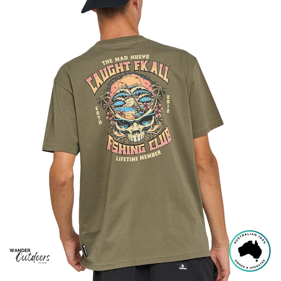 The Mad Hueys Caught Fk All Tee in olive green, back view showing bold surf and fishing skull graphic with island design.