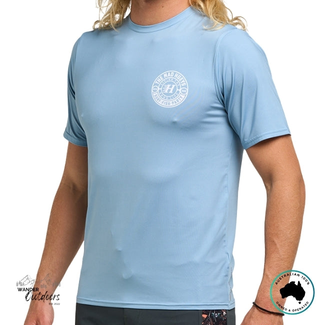 Light blue t-shirt Rashie with The Mad Hueys Good Life Logo worn by a person on a white background