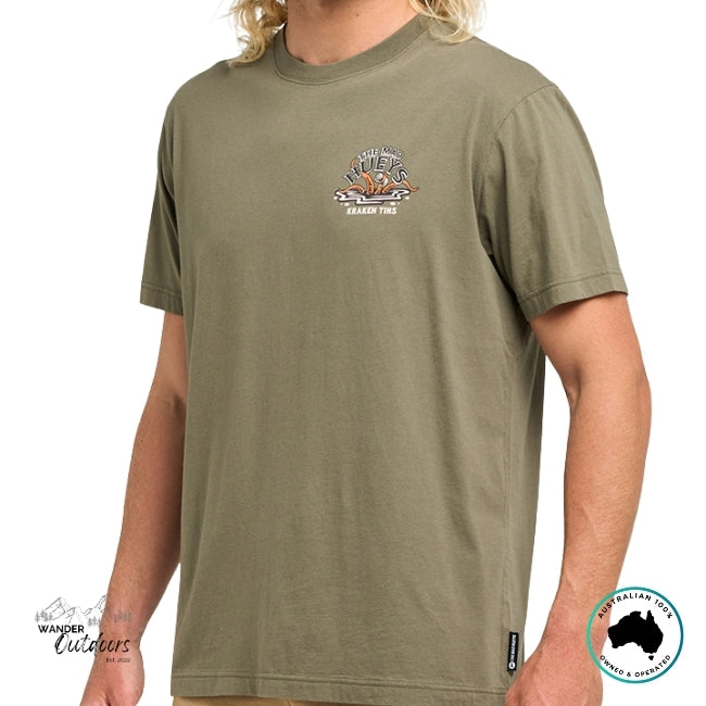 Person wearing a green t-shirt with The Mad Hueys Kraken Design on a white background