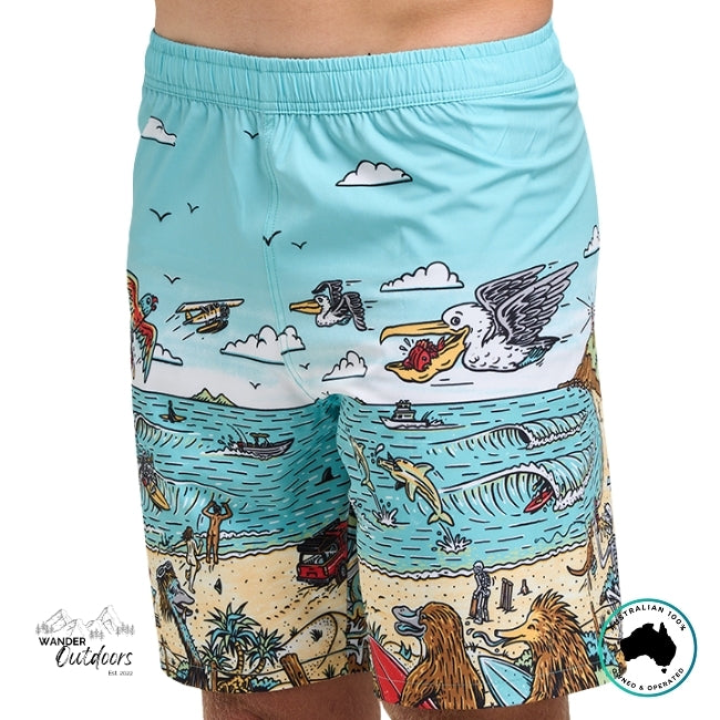 Beach-themed shorts with animal and nature illustrations on a light blue background.