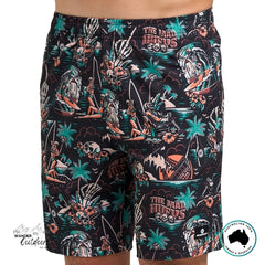 Tropical-themed shorts with a visible The Mad Hueys Logo on a white background