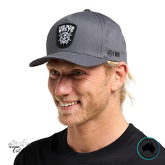 Man wearing a grey cap with The Mad Hueys Ship, Wheel, Beers Logo on a white background