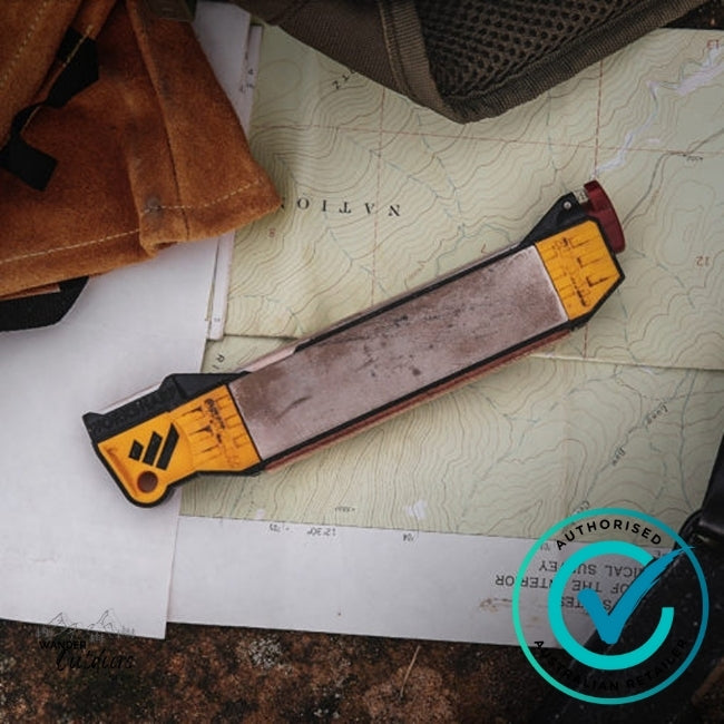 Work Sharp Guided Field Sharpener with replacement diamond plates shown in use outdoors on a topographic map, featuring yellow and black handle with coarse and medium sharpening plates.