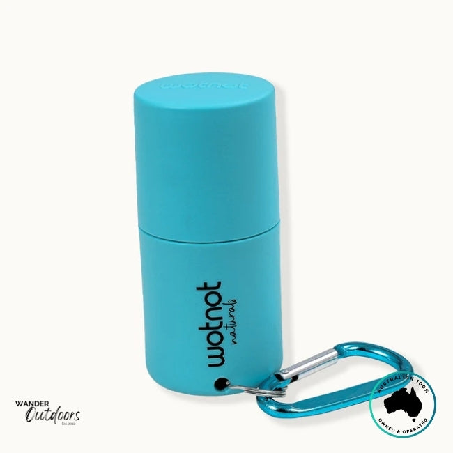 Side angle of closed Wotnot Refillable Sunscreen Roll-On Applicator with attached teal carabiner.